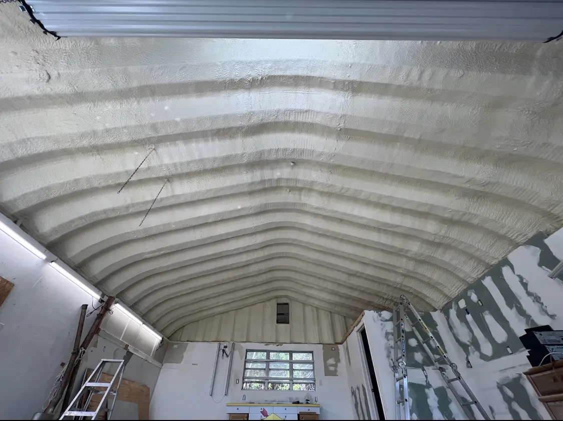 Spray polyurethane foam applied to the underside of a metal roof deck in Bergenfield